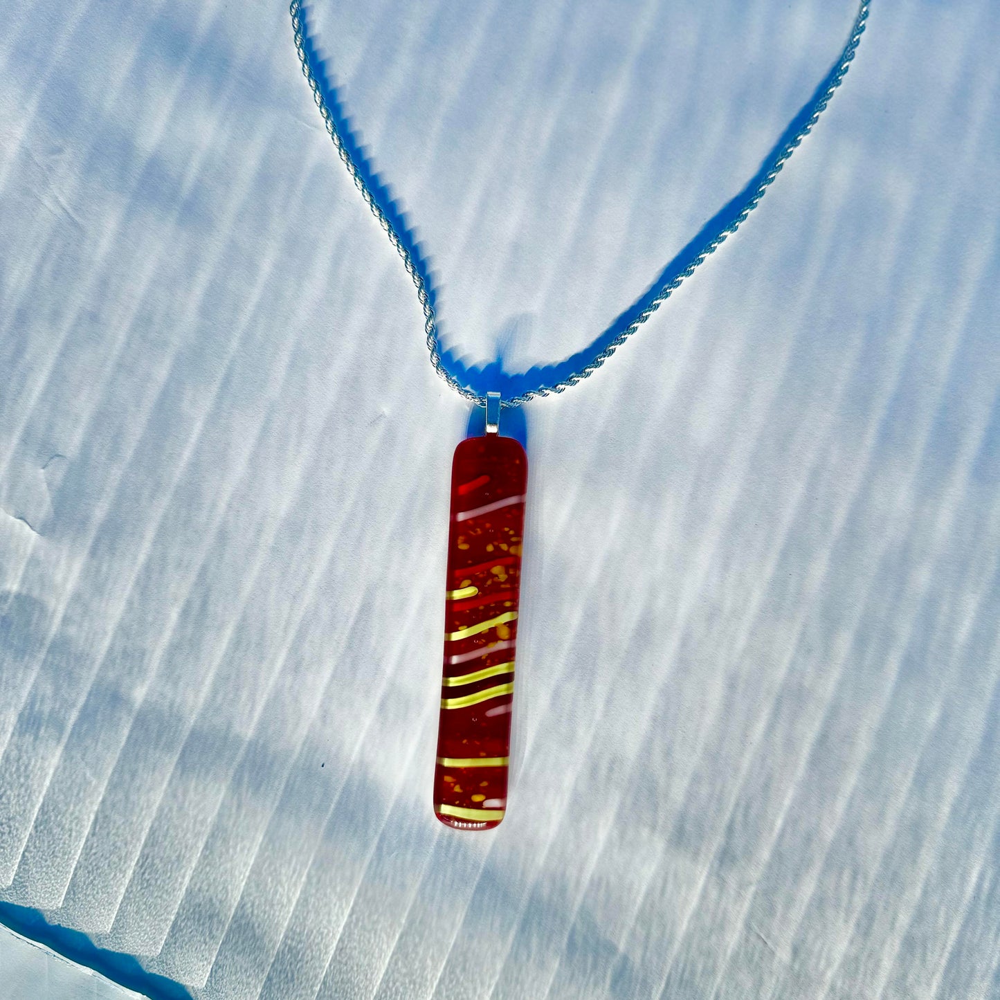 Red Antique glass pendant with Yellow stringers