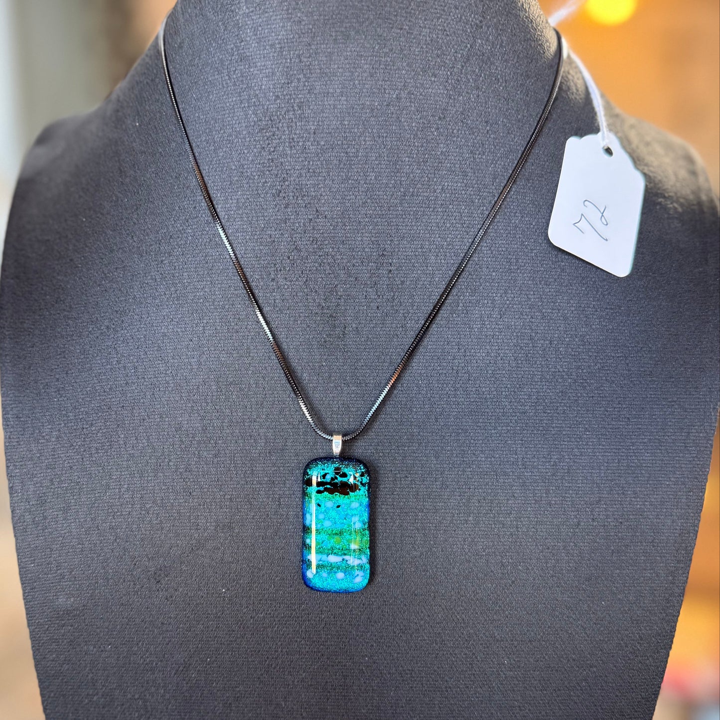 Clear Spectrum glass with Translucent Green Strings and Firelight/Black frit