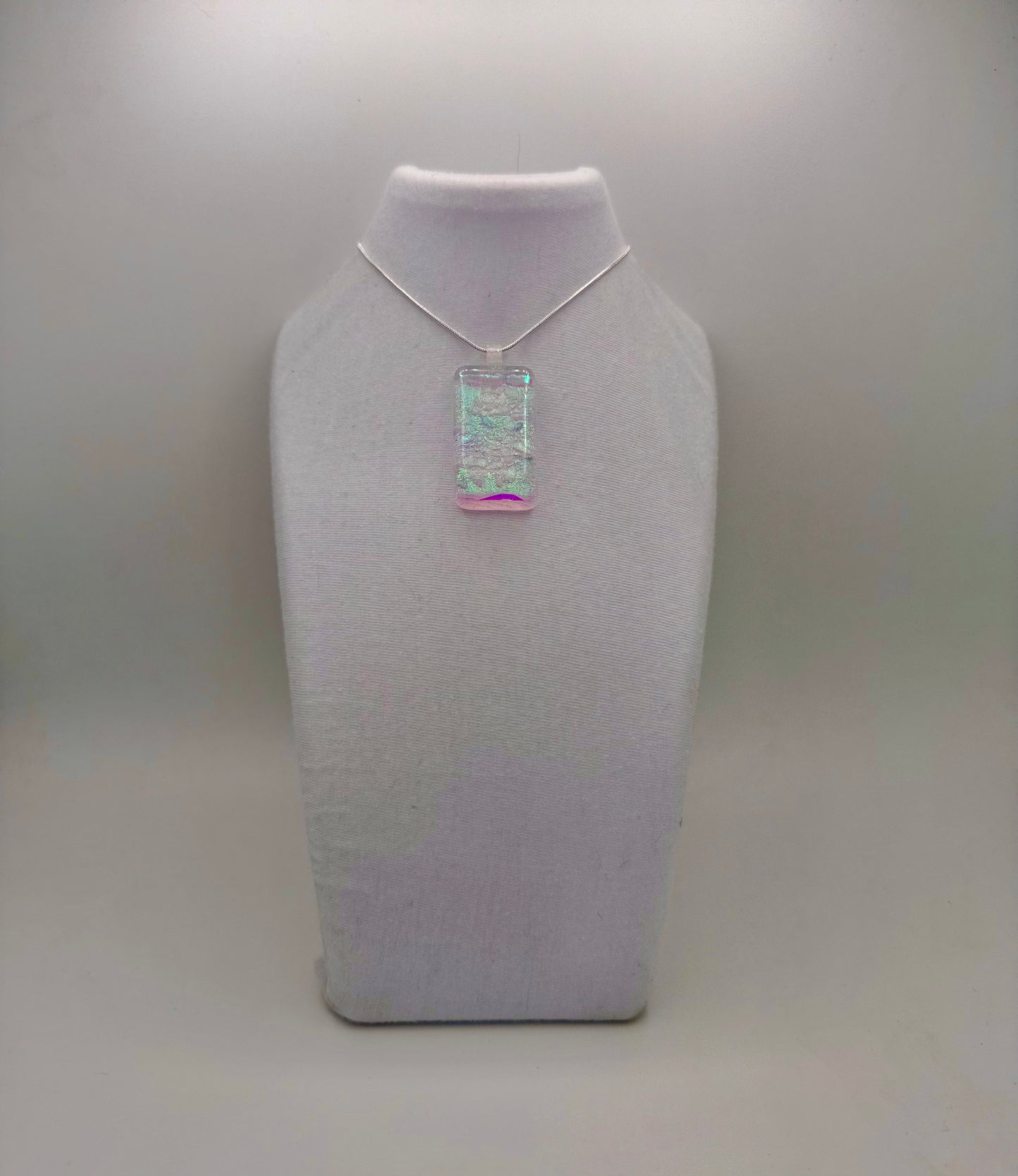 Clear Spectrum glass with firelight frit over Teal, Pink Dichroic glass