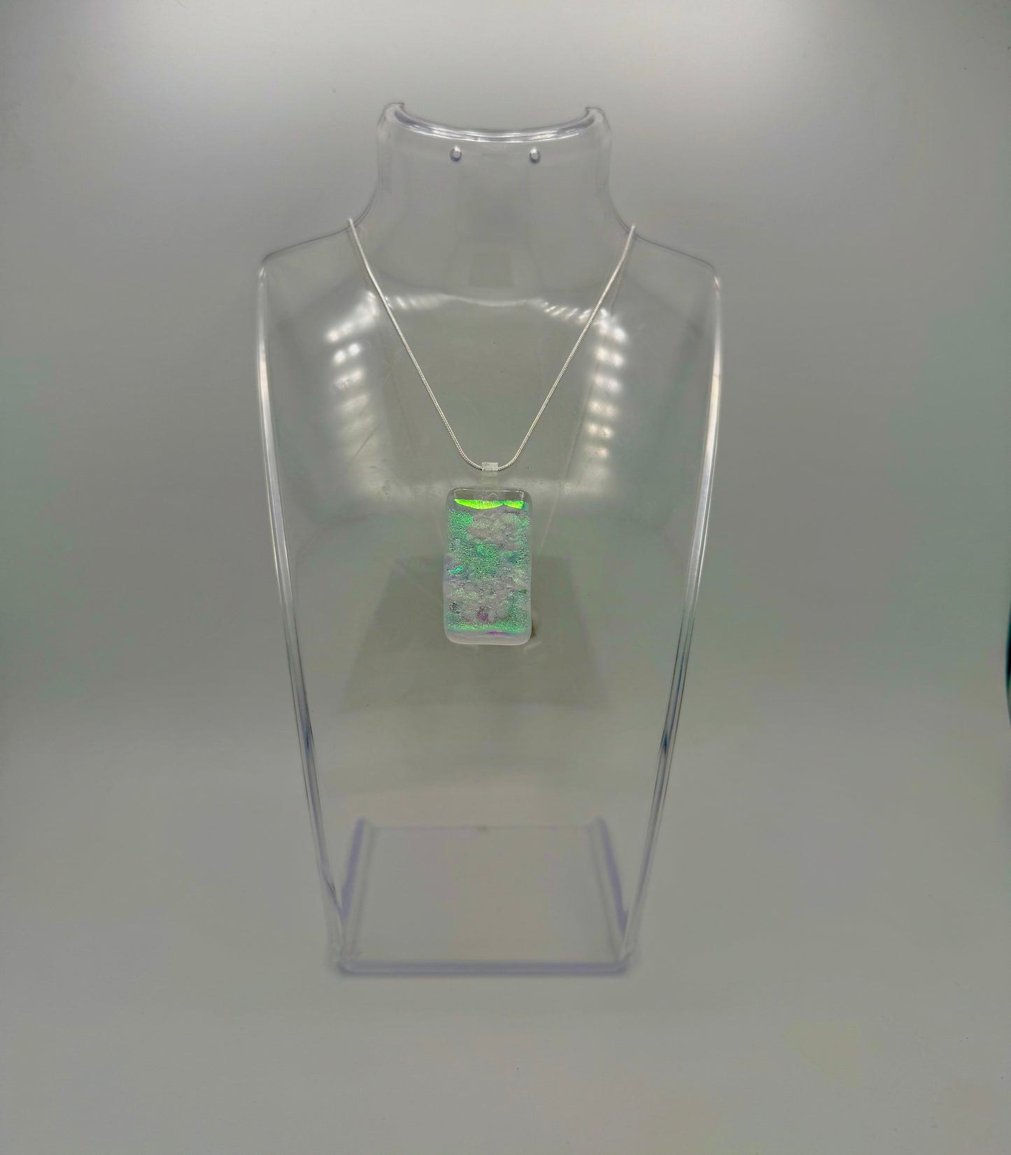 Clear Spectrum glass with firelight frit over Teal, Pink Dichroic glass