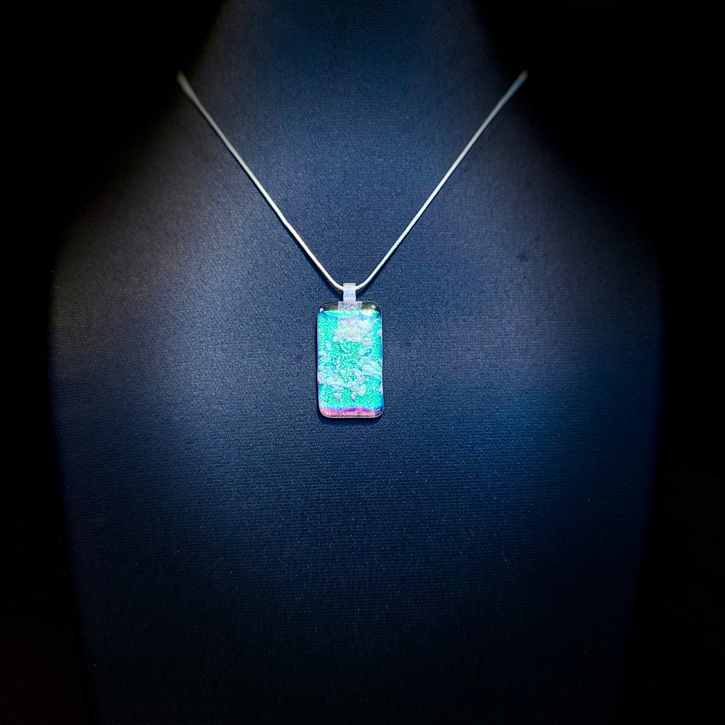 Clear Spectrum glass with firelight frit over Teal, Pink Dichroic glass