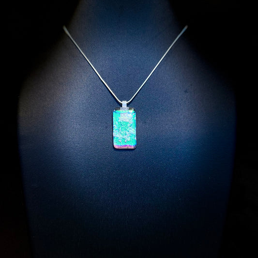 Clear Spectrum glass with firelight frit over Teal, Pink Dichroic glass