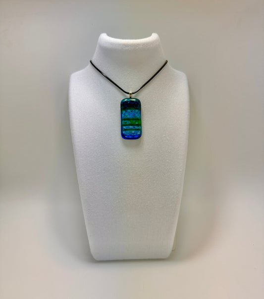 Clear Spectrum glass with Translucent Green Strings and Firelight/Black frit