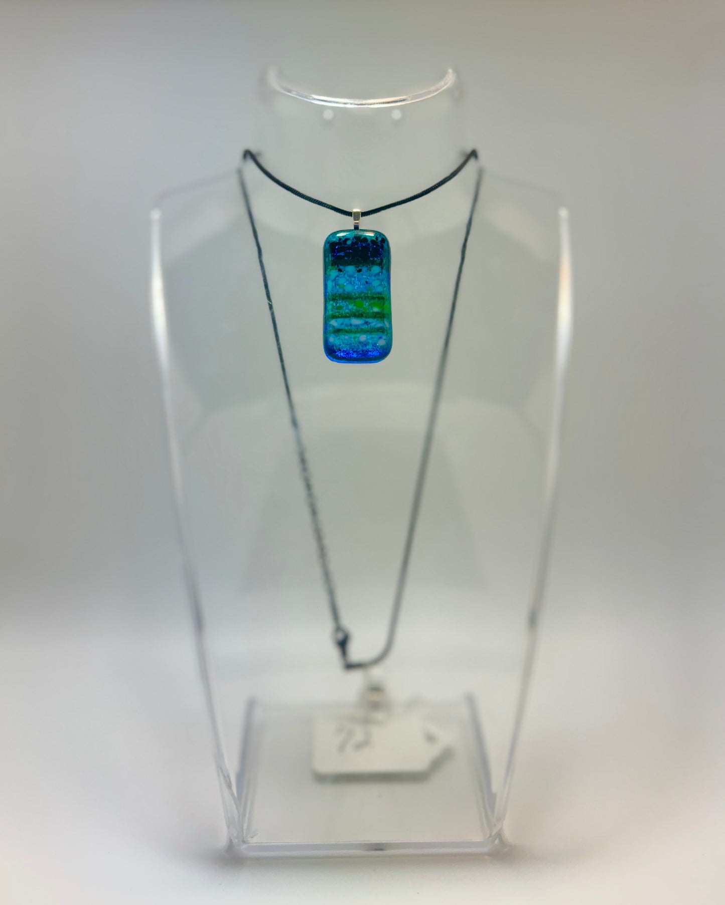 Clear Spectrum glass with Translucent Green Strings and Firelight/Black frit